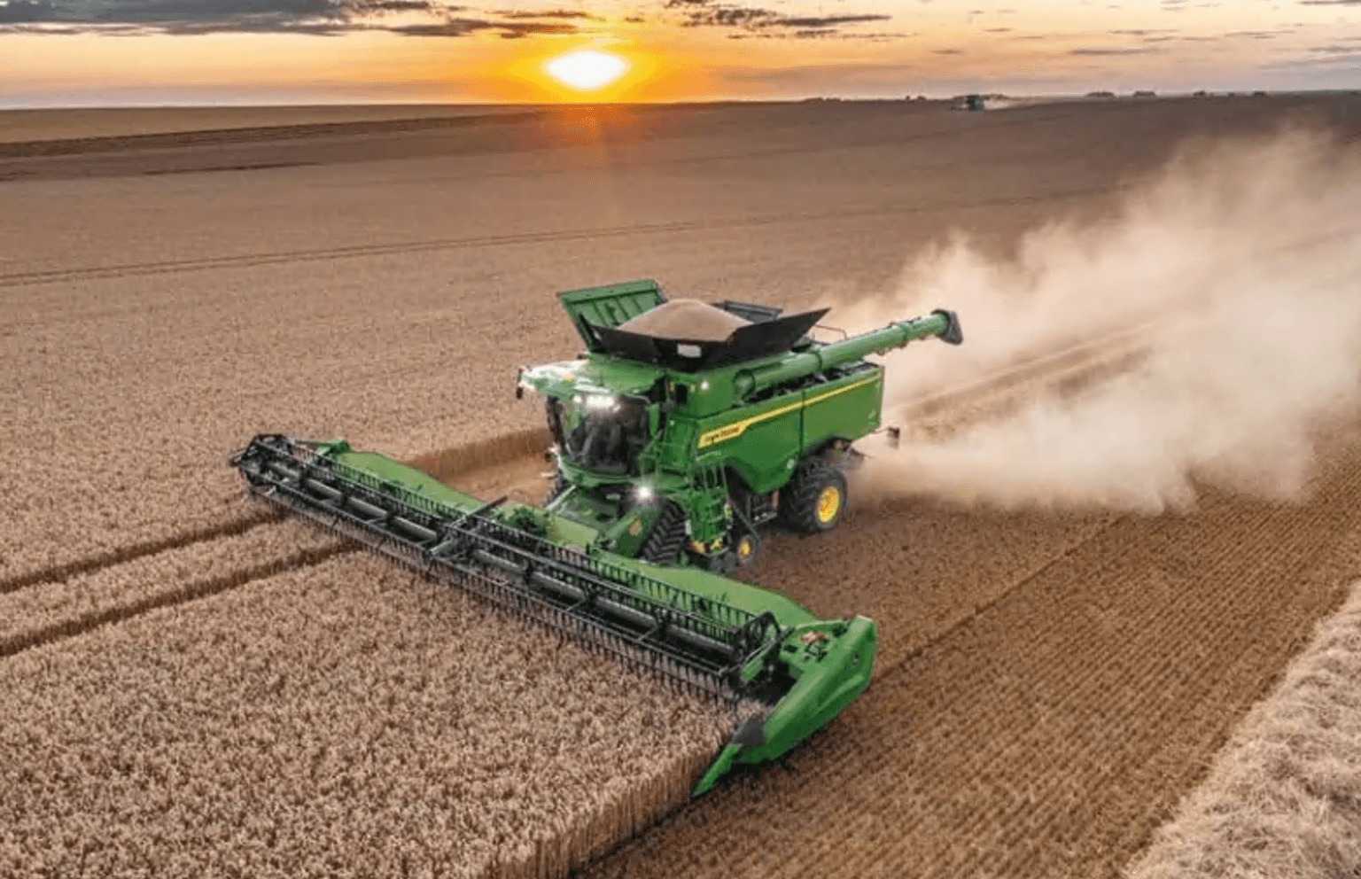 Image of john deere tractor at sunest